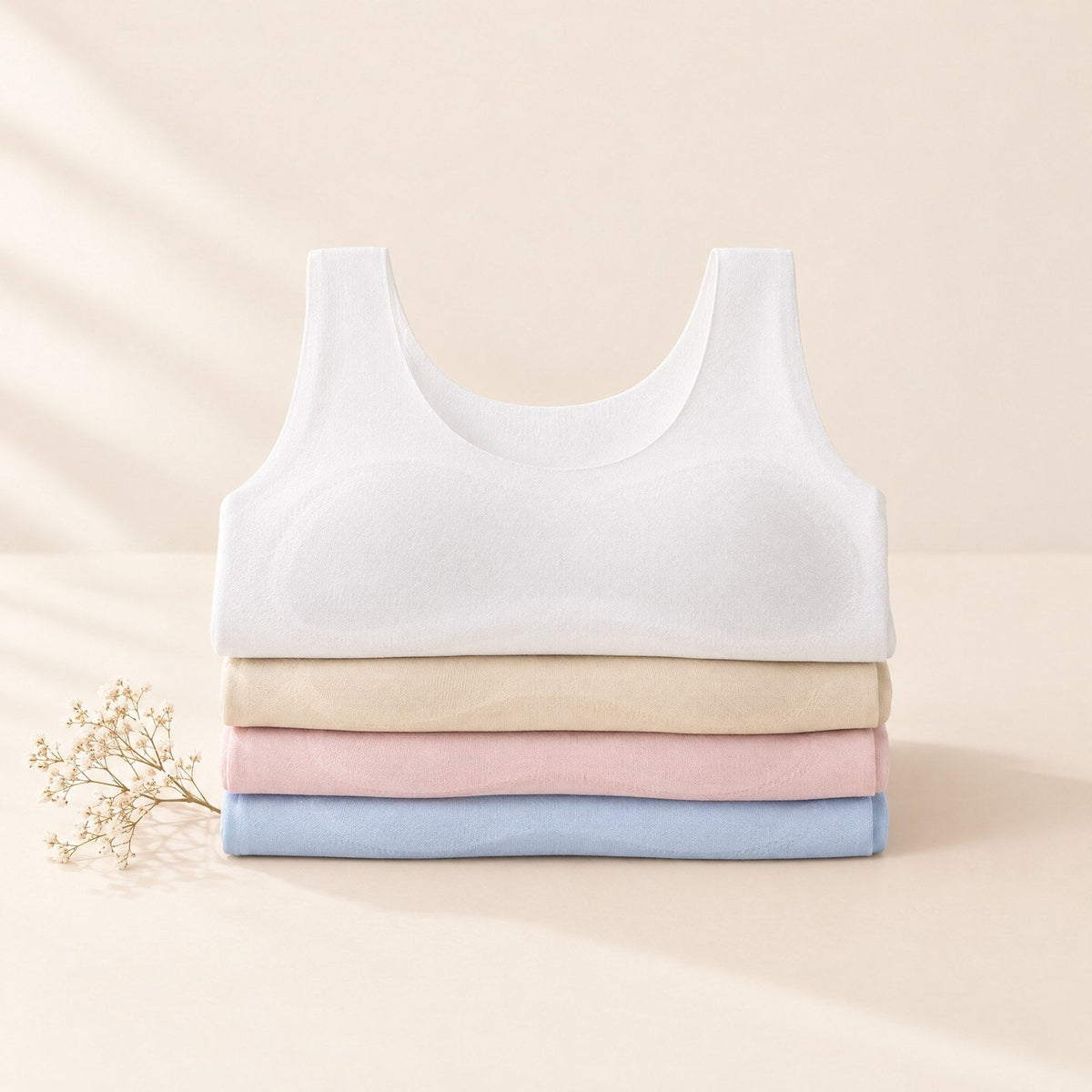 Brassières Cocobody pliées : blanc, beige, rose et bleu ciel